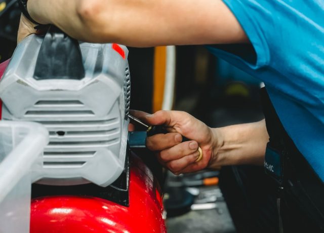 Technician repairing industrial air compressors